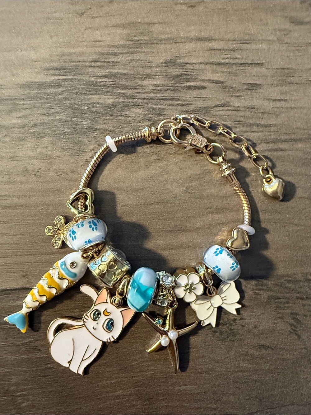 Gold-tone Charm Bracelet with Blue Enamel Beads & Cat Charm